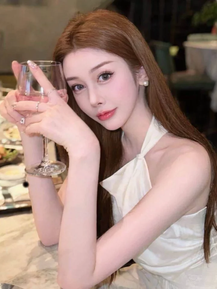 Lanna standing in a modern private room setting in Singapore