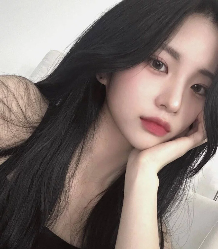 Professional portrait of Jiyoung in soft lighting, wearing neutral-toned attire
